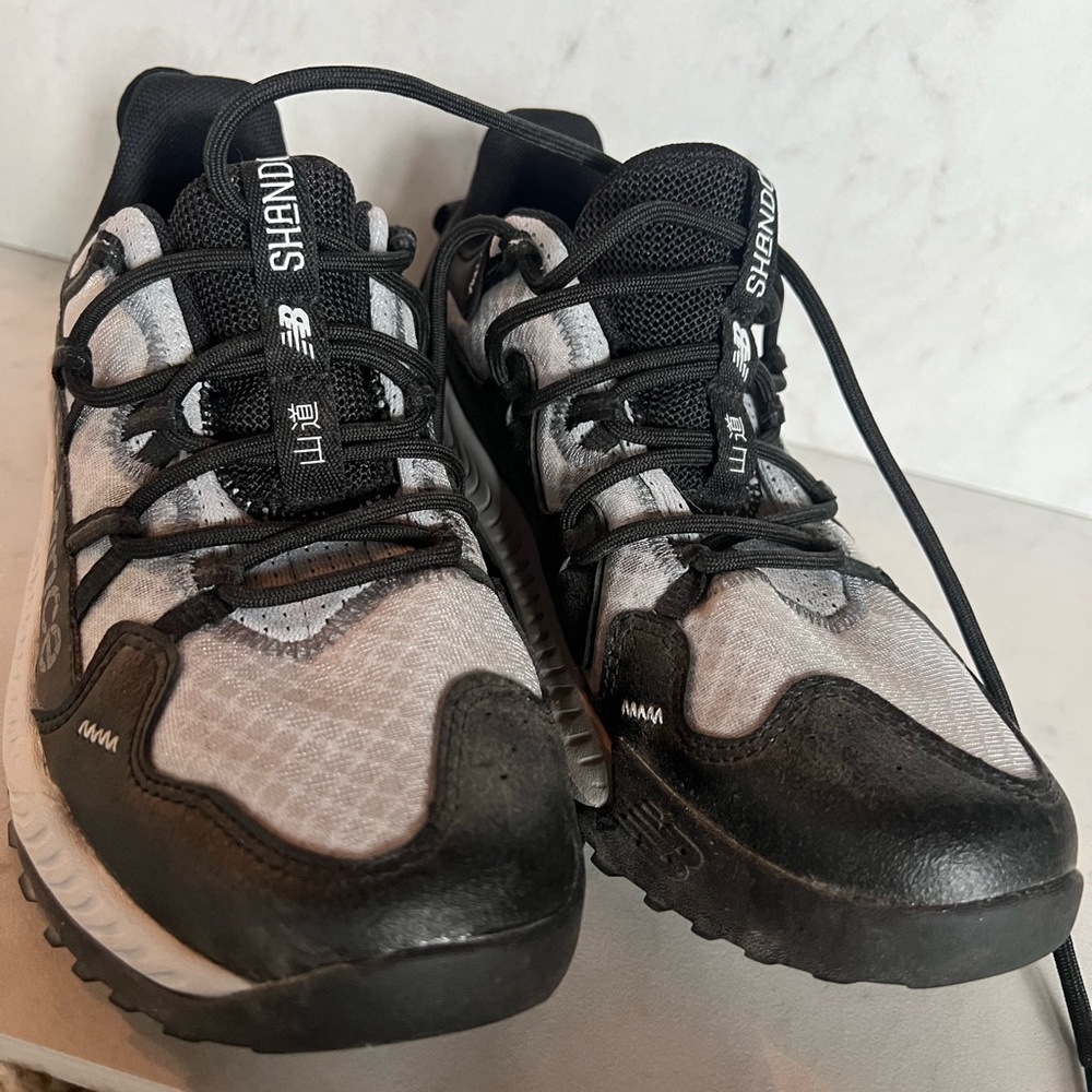 New Balance. Shanda. Women’s size 5. Black and gray.